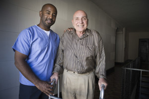 Portrait of a male healthcare worker with elderly man