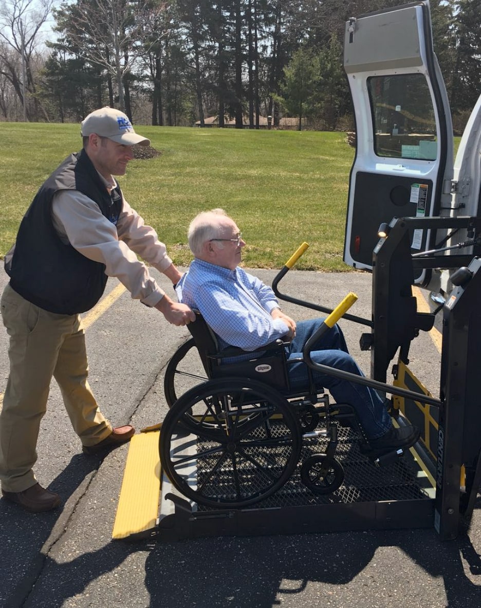 Wheel Chair being loaded into a van.